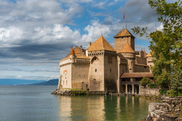 Chateau de Chillon at Lake Geneva in Montreux, Switzerland MONTREUX, SWITZERLAND - September 06: Castle Chillon (Chateau de Chillon) at Lake Geneva in Montreux, Switzerland on September 06, 2017 chateau de chillon photos stock pictures, royalty-free photos & images