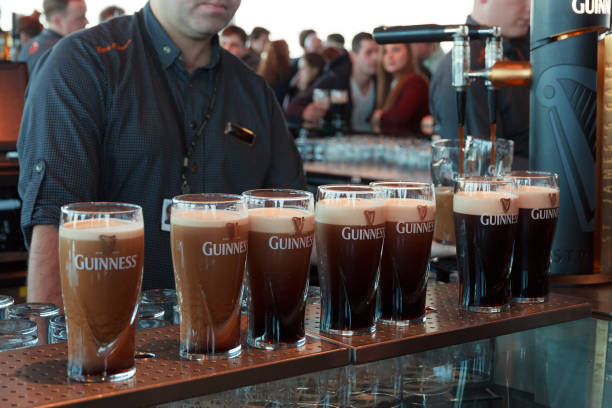 guinness pints - guinness stock-fotos und bilder