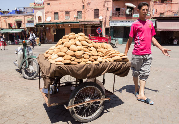 MARRAKECH, MOROCCO - APR 29, 2016: Street vendor selling Moroccan bread from a cart in the Medina of Marrakech