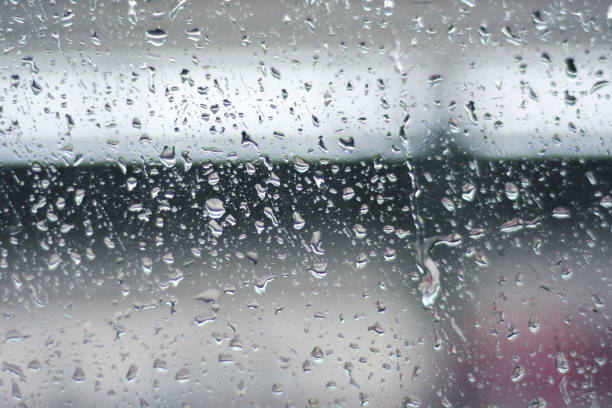 istock Rainy stripes on a beautiful glass with drops of water. 855879448