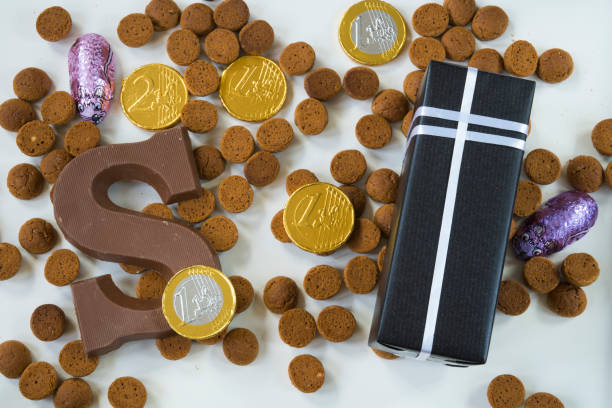 istock flat lay, present, ginger nuts with chocolate letter, against white background, for the fifth of December, event Sinterklaas 855882454