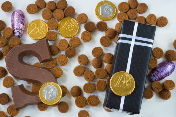 istock flat lay, present, ginger nuts with chocolate letter, against white background, for the fifth of December, event Sinterklaas 855882470
