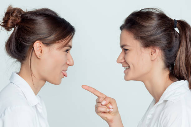 istock Studio portrait of female twins 855882794