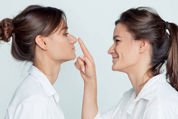 istock Studio portrait of female twins 855883280