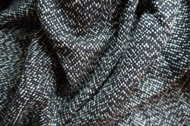 istock Crumpled salt and pepper woolen tweed fabric 855886716