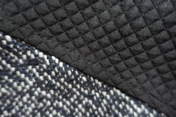 istock Grey tweed and black polyester fabric sewn together 855887224