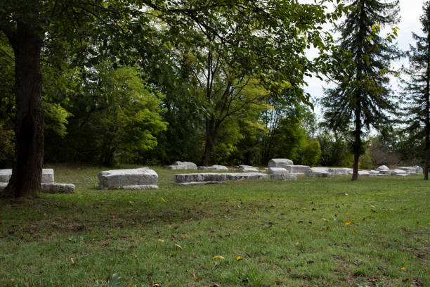 istock Medieval necropolis from 14th century called Mramorje. Located in Perucac national park Tara, Serbia. Thombstones of different shapes. Graveyard overgrown with vegetation, forgotten in time 855891482