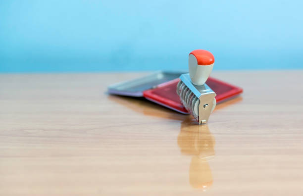 istock Rubber stamp and ink  on desktop in office. 855891540