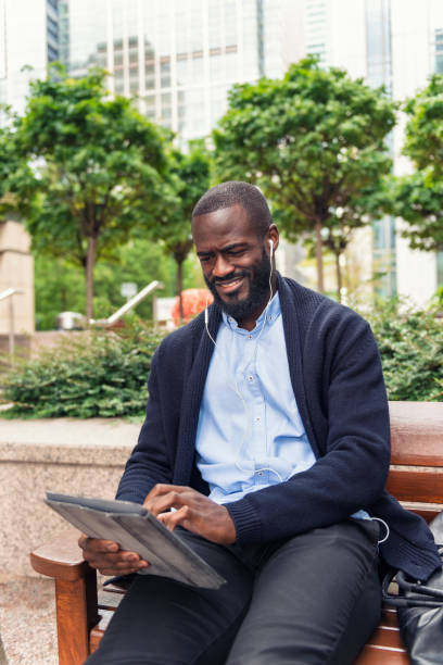 istock Young businessman working outdoors in Canary Wharf 855891672