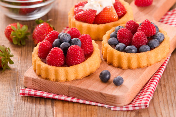istock Tartlets with forest fruits. 855892094