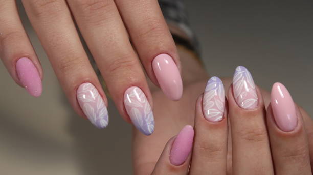 istock Manicure design delicate nails from woman 855892278
