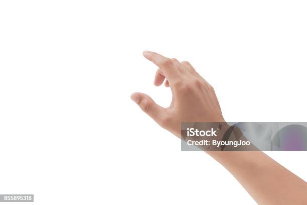 A Hand Touching Something Like A Button Or Display Device On White Backgrounds Isolated Stock Photo - Download Image Now