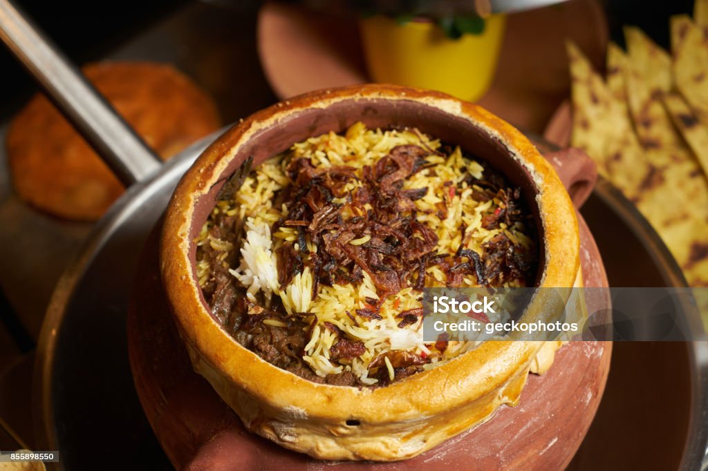 Pilaf rice with meat and vegetables Pilaf rice with meat and vegetables. Delicious Indian food Hydrabadi soya chunks Biryani vegetable soy Pilaf served in clay pot. Healthy food Clay Stock Photo