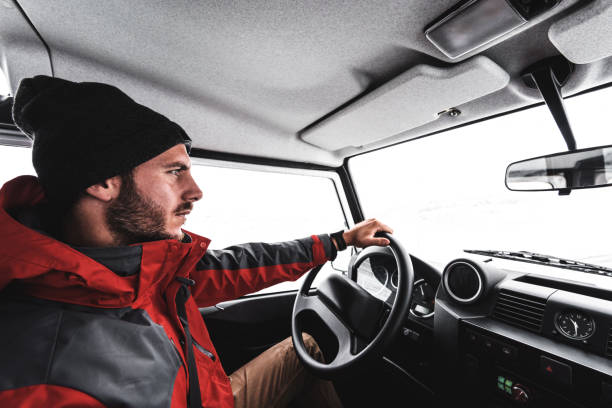 istock man driving a car in the mountain 855906302