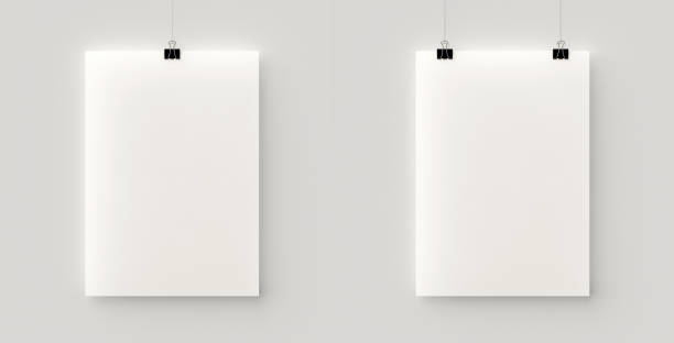 Set of 2 blank posters hanging on a thread with black clips