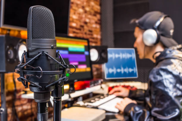 Sound engineer working with audio recordings on daw software interface, editing and adjusting volume levels for new music. Producer adding sound effects on soundtracks, signal processing.