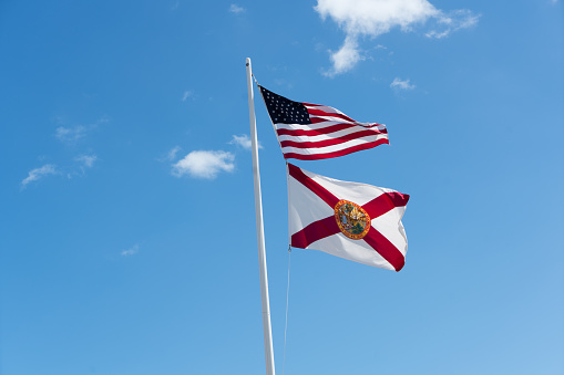 Two flags, United States and Florida, on flag pole