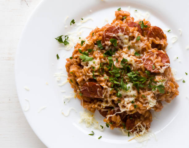 Chorizo risotto with tomato stock photo