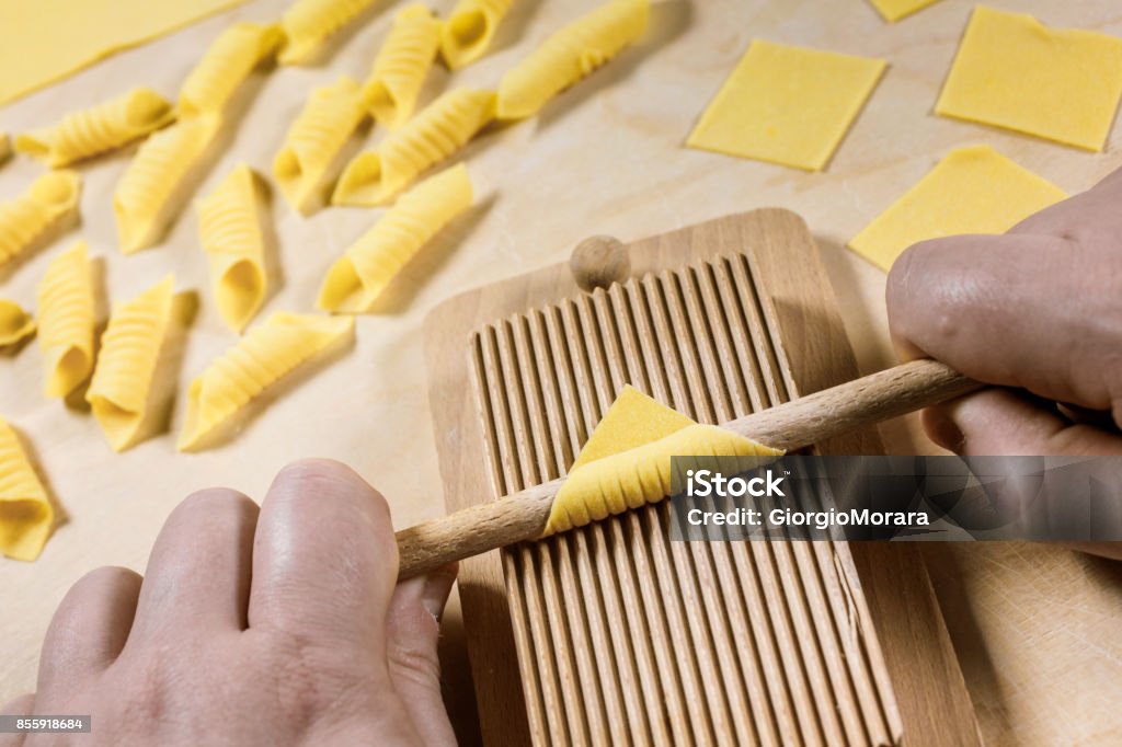 Garganelli, a kind of special homemade macaroni, at the end of preparation process. Activity Stock Photo