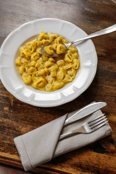 Tortellini with broth. Typical homemade fresh stuffed pasta cooked in broth.