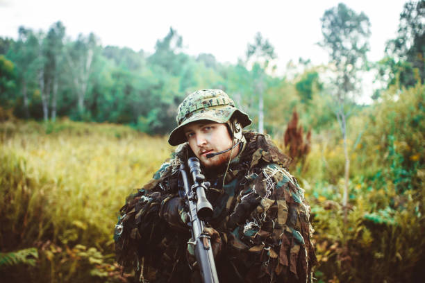 istock a man in a military uniform weapon 855921330