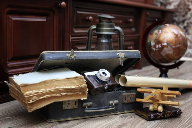 istock composition on a wooden floor vintage globe with old leather sui 855923852