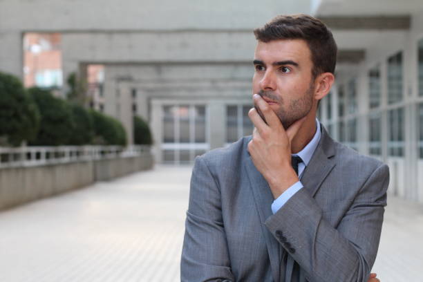 istock Businessman deep in thoughts close up 855924020