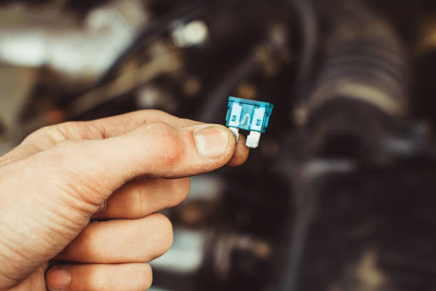 istock automotive fuse in hand 855935758