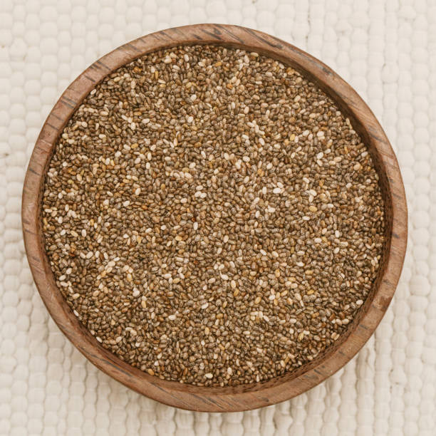 istock Chia seeds in the wooden bowl 855939758