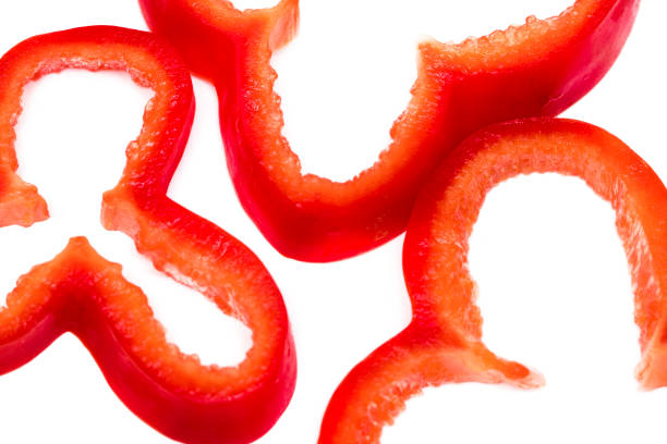 istock Red sweet bell pepper slices isolated on white background 855946642