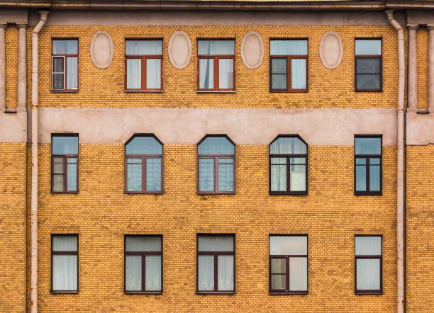 istock Windows in a row on facade of apartment building 855947920