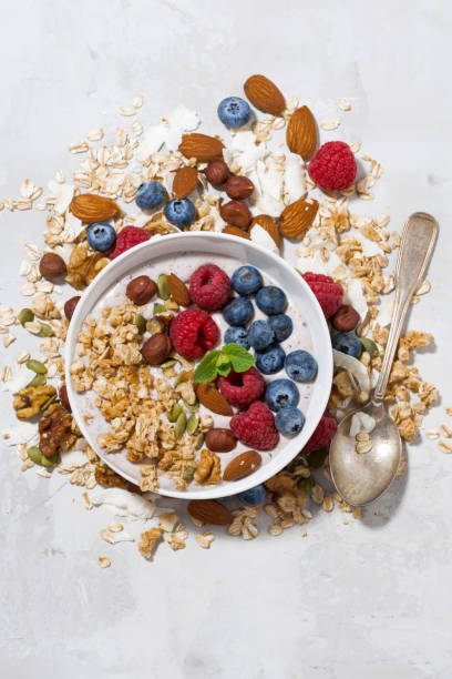 istock homemade muesli with yogurt and berries, top view vertical 855954468