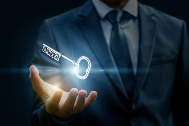 istock Businesswoman showing a key in his hand. 855958564