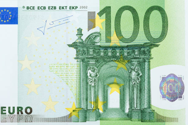 Photo of one hundred euro banknote in macro shot Photo of one hundred euro banknote in macro shot. High resolution photo. european union euro note stock pictures, royalty-free photos & images