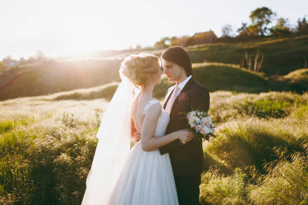 istock Wedding couple on a walk in nature 855970100
