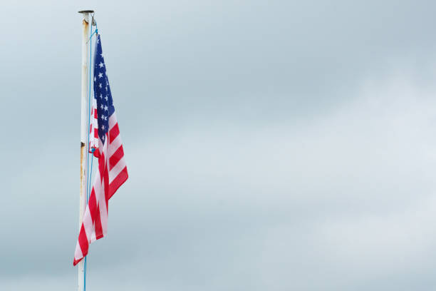 istock The American flag on a flagpole 855970674