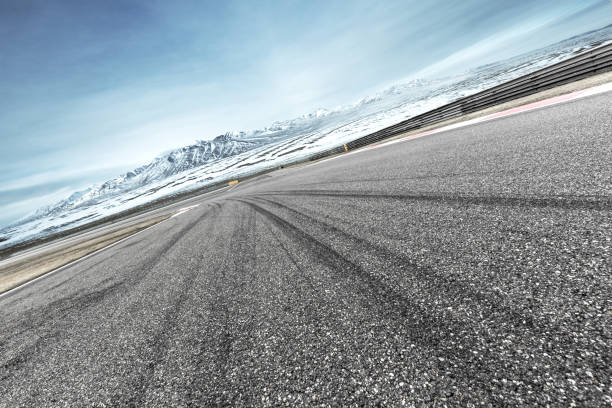 istock empty asphalt road with beautiful snow mountains 855973134