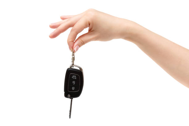 istock Female hand holds car keys. 855973250