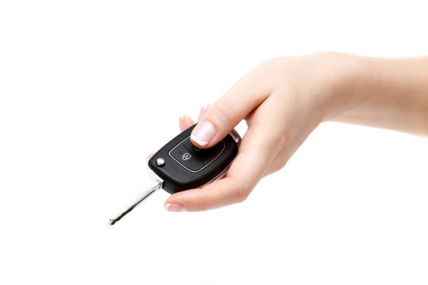 istock Female hand holds car keys. 855973360