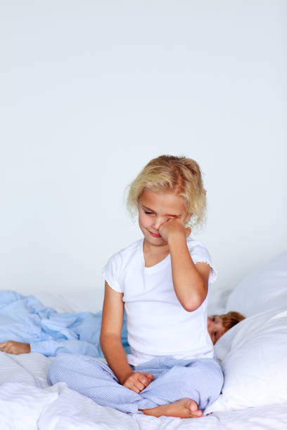 istock Adorable girl on a bed 855990752