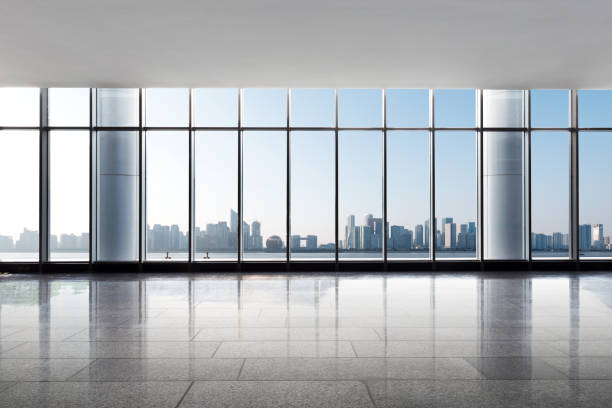 istock emtpy office with cityscape of modern city 855994434