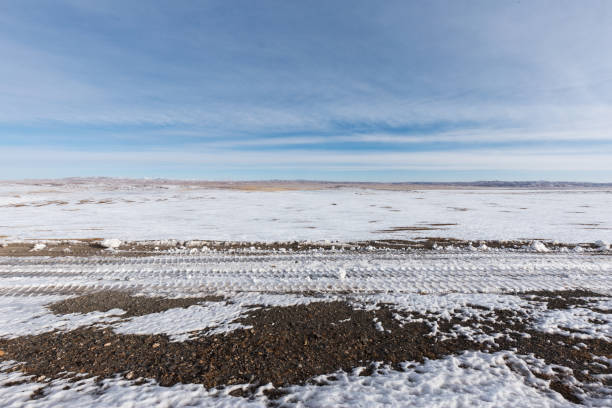 istock country road and hills with white snow 855994810