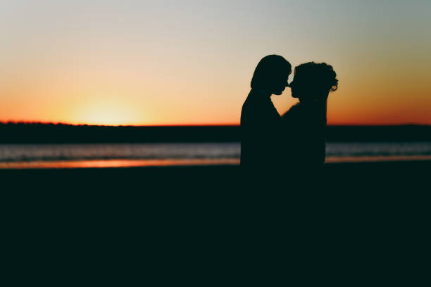 istock Groom and bride on a walk outdoors at the sea 856006794