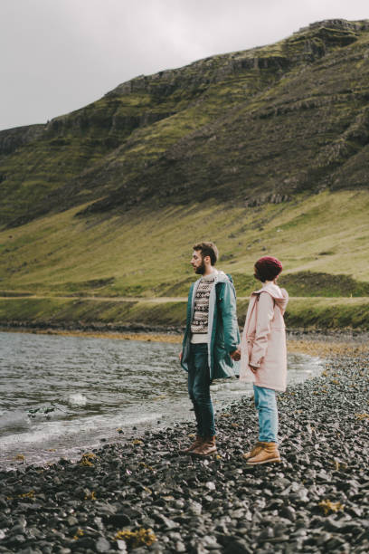 istock Couple walking on the beach in Iceland 856007286