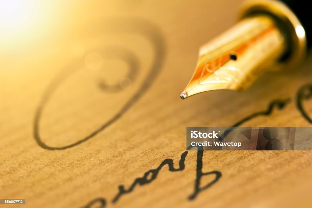 Pen and signature Fountain pen and signature - business banner background Gold - Metal Stock Photo