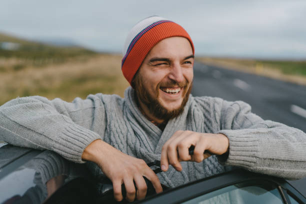 istock Man with camera taking photo near the car 856010384
