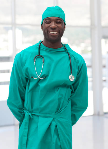 istock Charming doctor in green scrubs 856017570