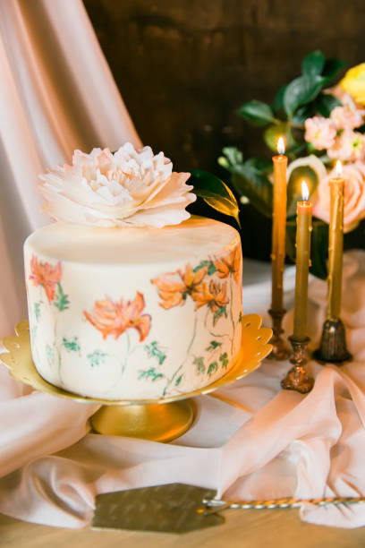 istock Frowers, candles and wedding painted cake. Still life 856018000