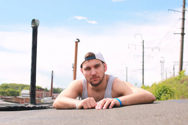 istock A man dressed in hip hop style poses 856020858
