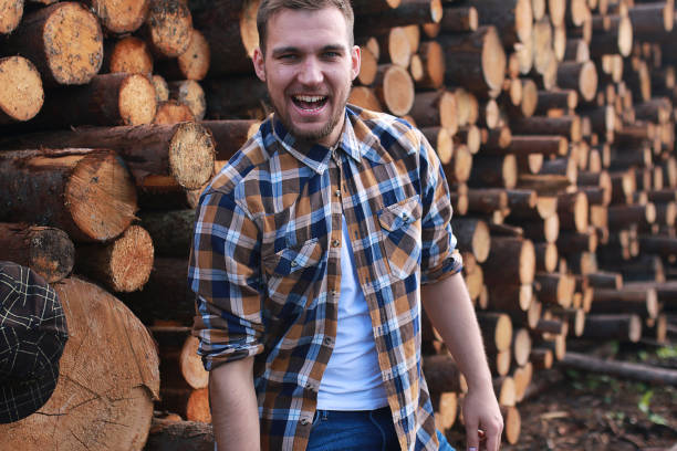 istock A man at the factory processing wood, sawing logs 856021078